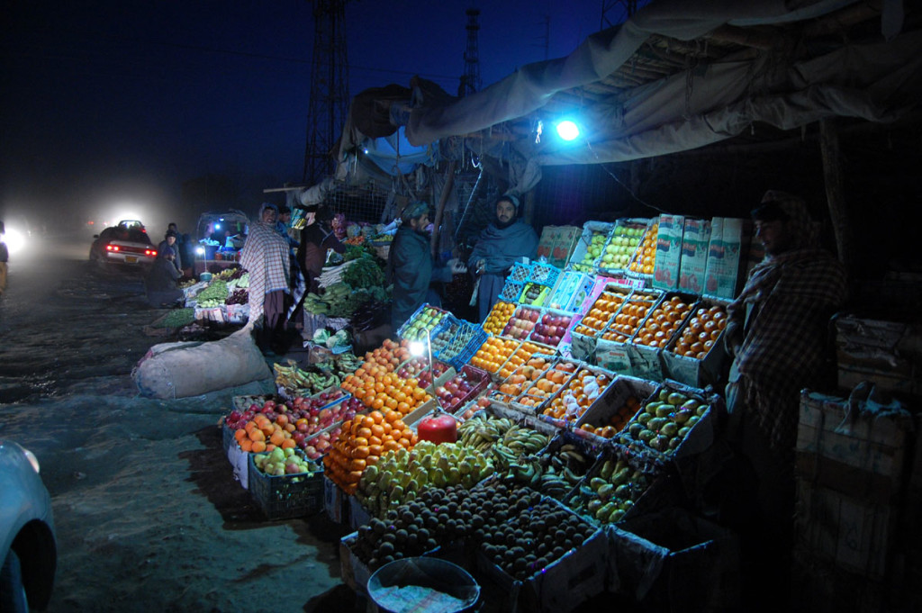 An Afghan refugee vendor waiting for customers at his stall of fruit on the road side at Pakistani border town Chaman, along with Afghanistan border on Wednesday, January 14, 2015. Photo by Matiullah Achakzai.